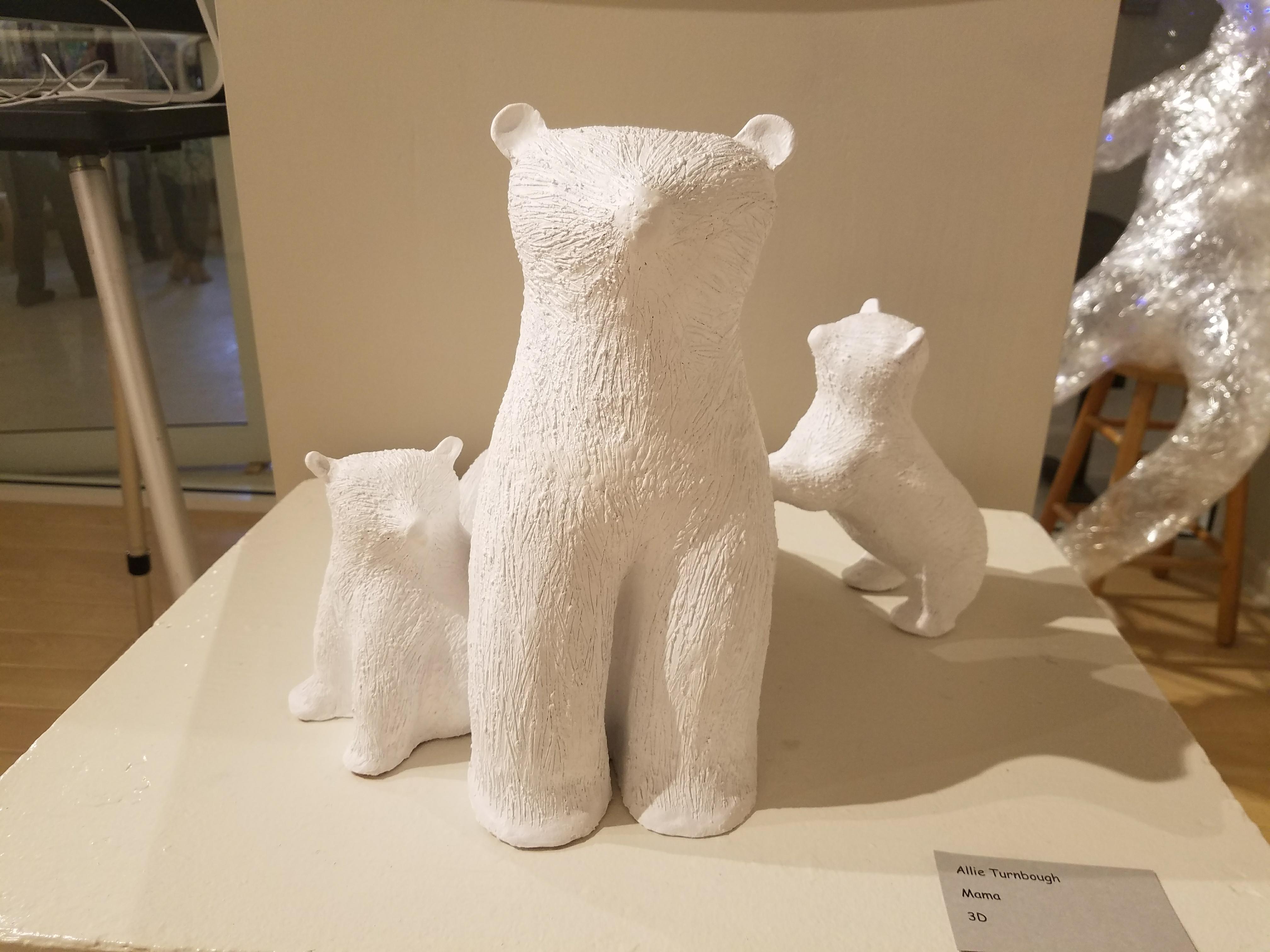 white clay cat and babies