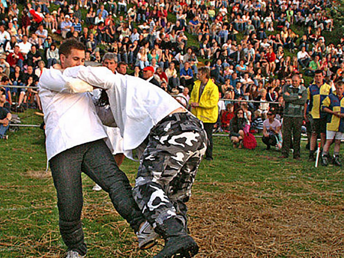 Two guys kicking eachother in the shins