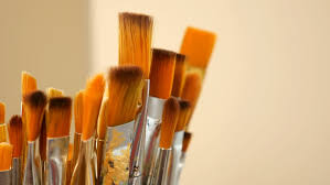 paint brushes in mellow lighting